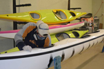 Tyson Desmarais working on the inside of Wave's kayak.